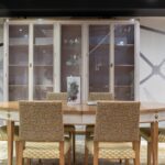 möbel heinrich kirchlengern - Elegant dining room setting with glass cabinet, table, and cushioned c